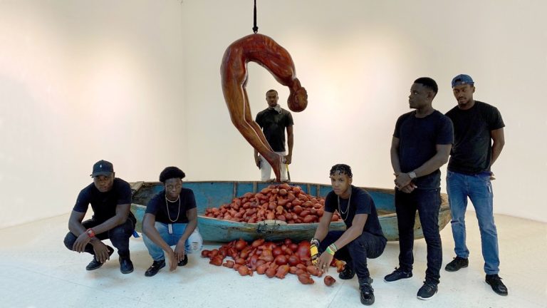 HEART OF A MAN, 2019, wood and fiberglass canoe, cedar and mahogany hearts, rope, metal, 18’ x 18’ with Laura Facey assistants