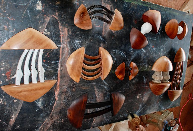 Arrows on studio table  Left to Right: HAPPY MAN, HARP ARROW, BOLD ARROW, FORWARD ARROW, PROUD ARROW, FAT ARROW, EGYPTIAN HARP ARROW, 2008, cedar and furniture fragments, various sizes