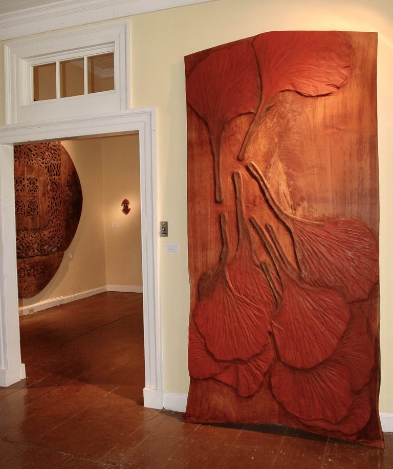 Foreground: POINCIANA BLOSSOMS, 2008, cedar, 98x54in Background: GRACE, 2008, mahogany 10’ x 10’, PROUD ARROW, 2008, cedar and furniture fragments, 12” x 7”