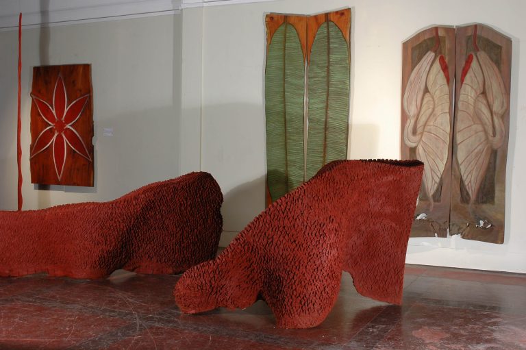 Foreground: ROOTS, 2006, cedar. Background: STAR, 2006, cedar, 50” x 72” x 1¼”, BANANA LEAF, mahogany, 42” x 105” x 1¼”, DUPPY FLY TRAP, 2006, cedar, 48” x 94” x 1¼”