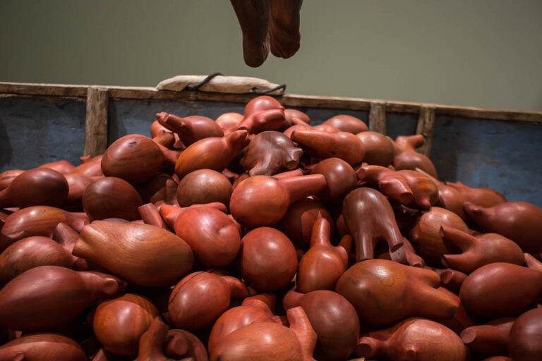 HEART OF A MAN, detail, 2019, cedar and mahogany hearts in wood and fiberglass canoe, rope,18’ x 18’