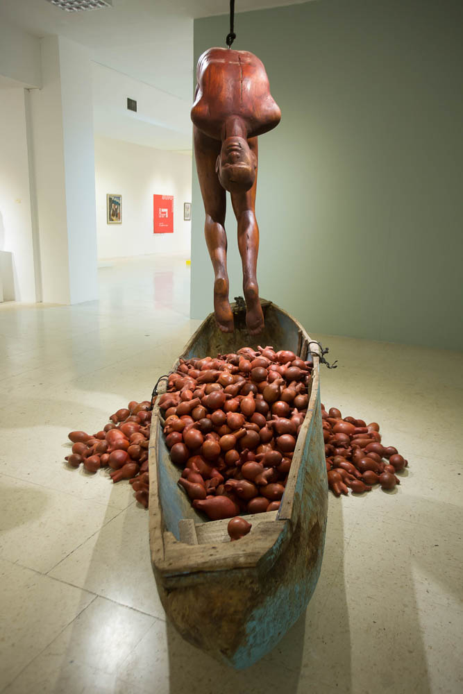 HEART OF A MAN, 2019, wood and fiberglass canoe, cedar and mahogany hearts, rope, metal, 18’ x 18’