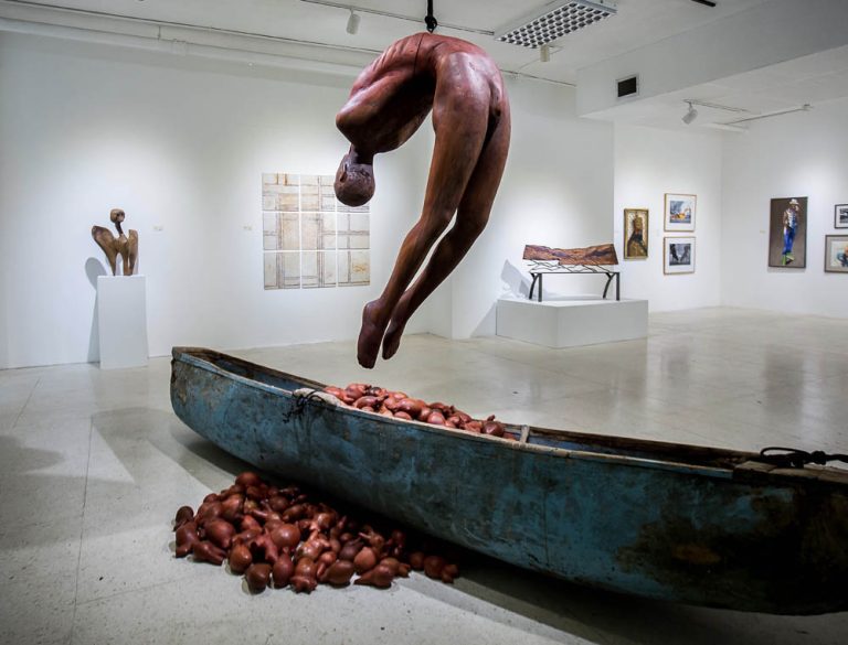 HEART OF A MAN, 2019, wood and fiberglass canoe, cedar and mahogany hearts, rope, metal, 18’ x 18’