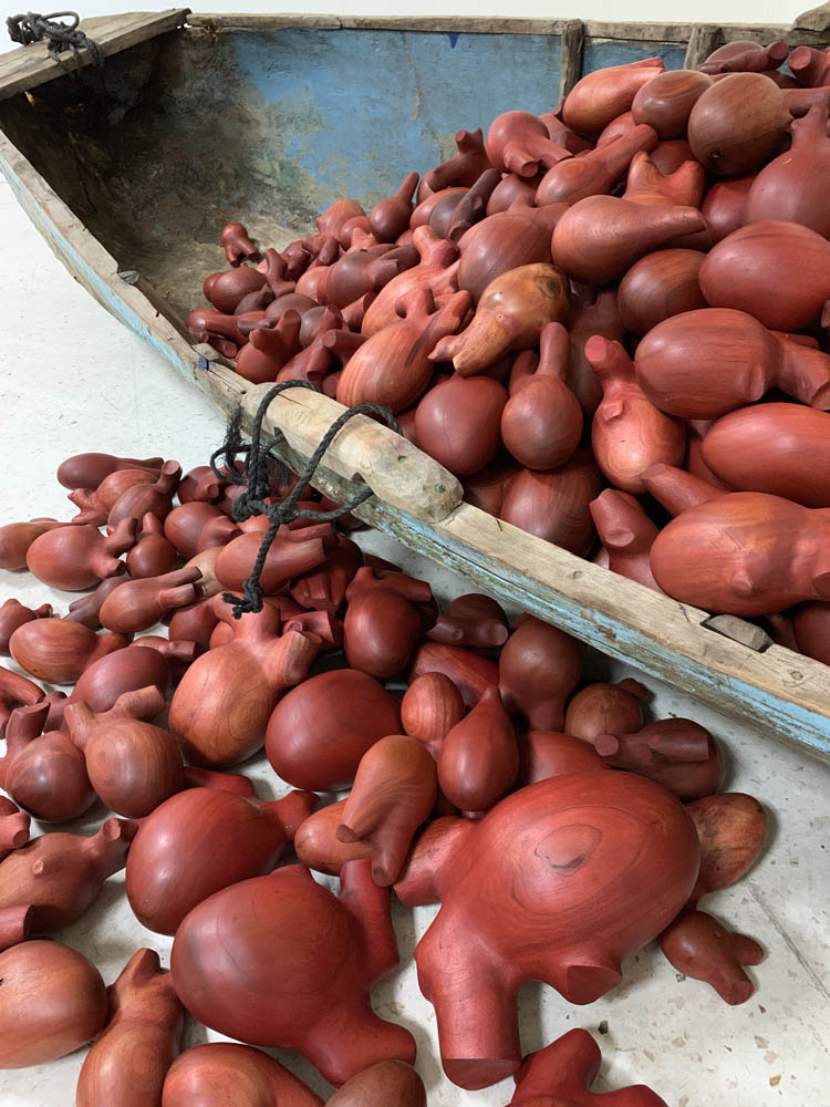 HEART OF A MAN, detail, 2019, cedar and mahogany hearts in wood and fiberglass canoe, rope,18’ x 18’