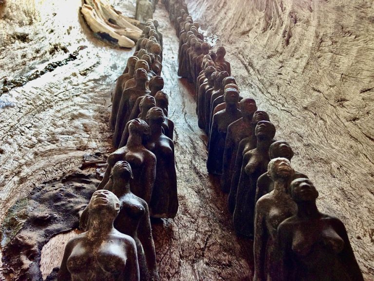 62 MEN AND 63 WOMEN, detail, 2015, resin figures in cottonwood canoe